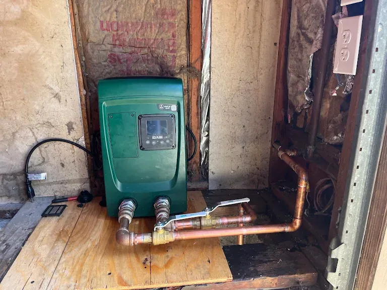 DAB e.sybox booster pump plumbed in copper with isolation valves inside a utility closet